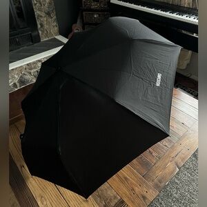 MOSCHINO • black compact umbrella designer luxury accessory automatic handle